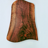 Eaglecreek Boards live edge black walnut wooden serving board with rich grain patterns on a white background