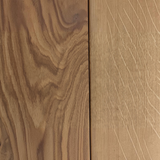 Close-up of the rich, natural wood grain texture on an Eaglecreek Boards round serving and cutting board.