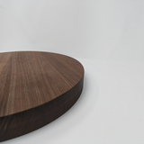 Eaglecreek Boards round wooden cutting board with a rich natural grain, perfect for serving or food preparation.