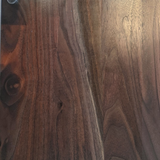 Eaglecreek Boards round wooden cutting board featuring a rich, dark natural wood grain pattern and smooth finish.