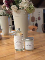 Eaglecreek Boards wood care maintenance set with a bottle of coconut wood oil and a jar of beeswax wood conditioner.
