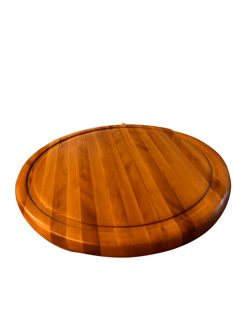 Wooden round cutting board on a white background