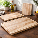 Eaglecreek Boards maple edge grain cutting boards in three sizes displayed on a kitchen countertop.