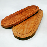 Eaglecreek Boards oval hardwood serving boards with juice grooves, showing natural wood grain and smooth finish.