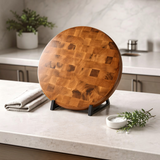 Eaglecreek Boards round end grain white oak butcher block cutting board displayed on a kitchen countertop stand.