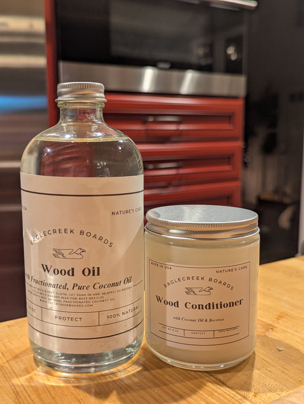 EagleCreek Boards Wood Oil and Wood Conditioner on a wooden surface with a blurred background.