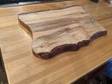 Hand carved rustic live edge maple wood cutting board