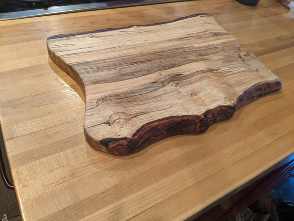 Hand carved rustic live edge maple wood cutting board
